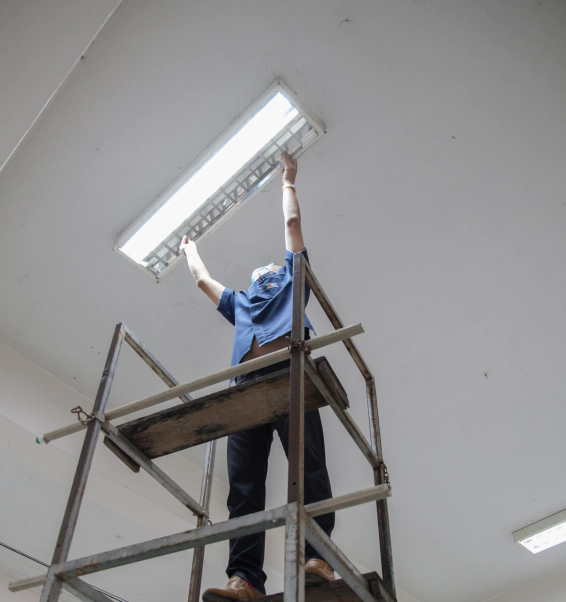 electrician fixing light