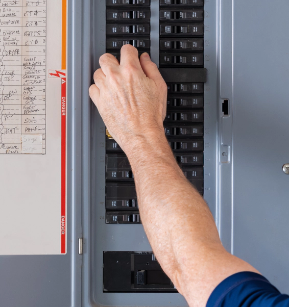 man operating new electrical panel