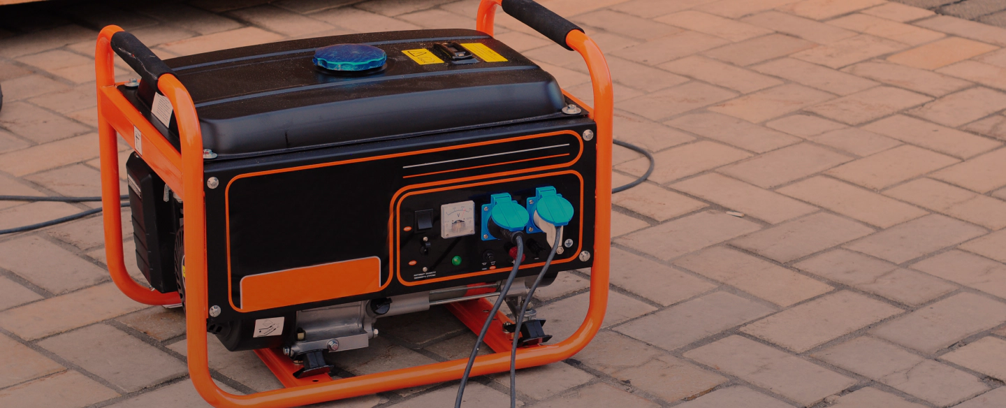 portable generator on a brick driveway
